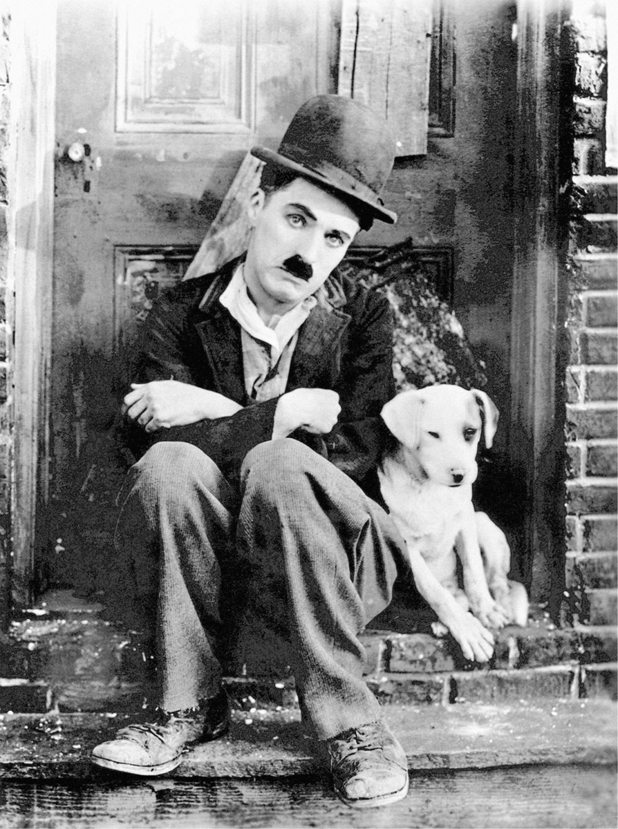 Charlie Chaplin en het puppy-fotobehang